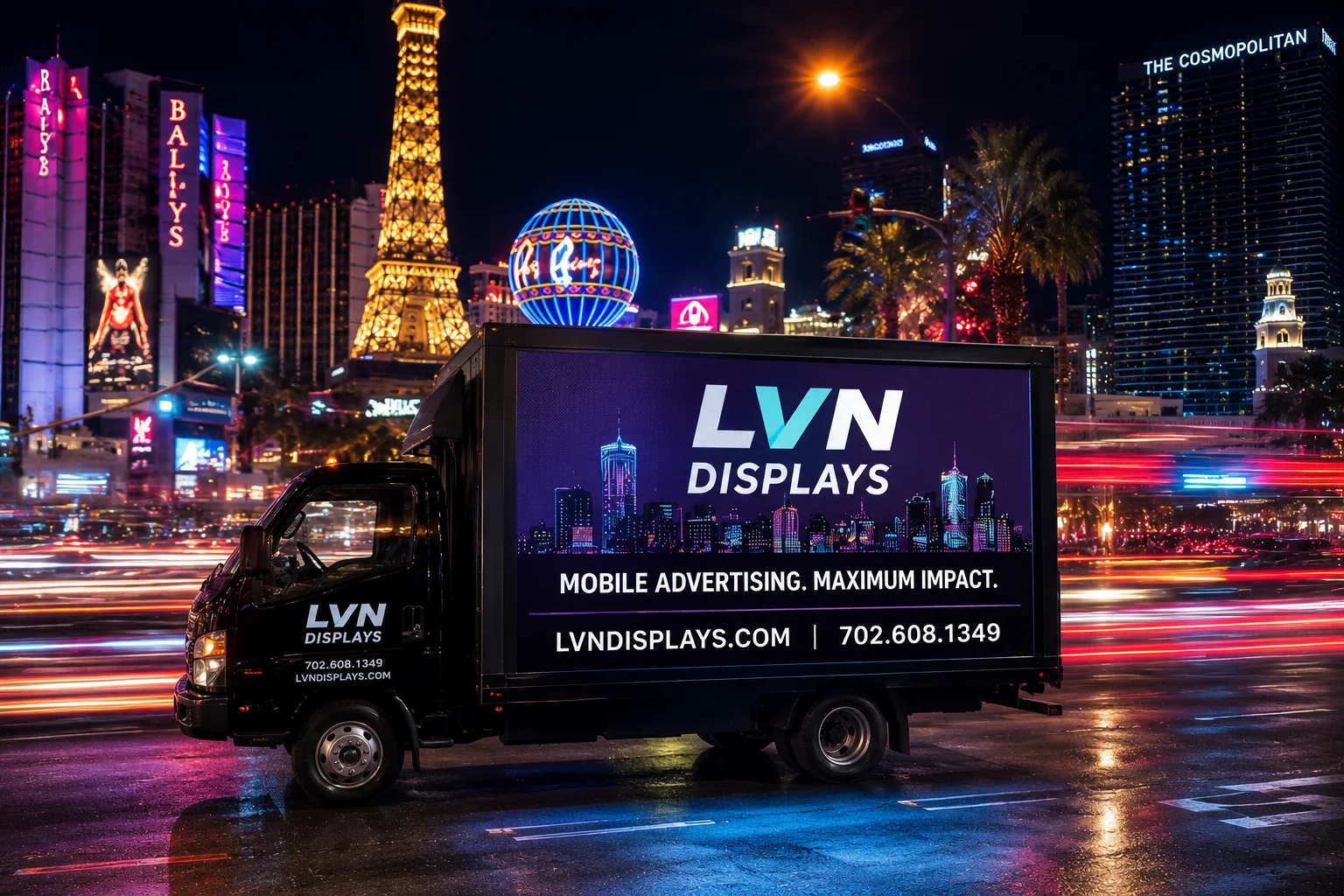 LVN Displays mobile LED advertising truck on the Las Vegas Strip past Bally's and Paris at night